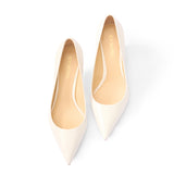 White patent pumps